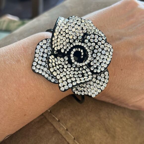 No Brand Jewelry - Black And Crystal Flower Cuff Bracelet with Hinge Closure.